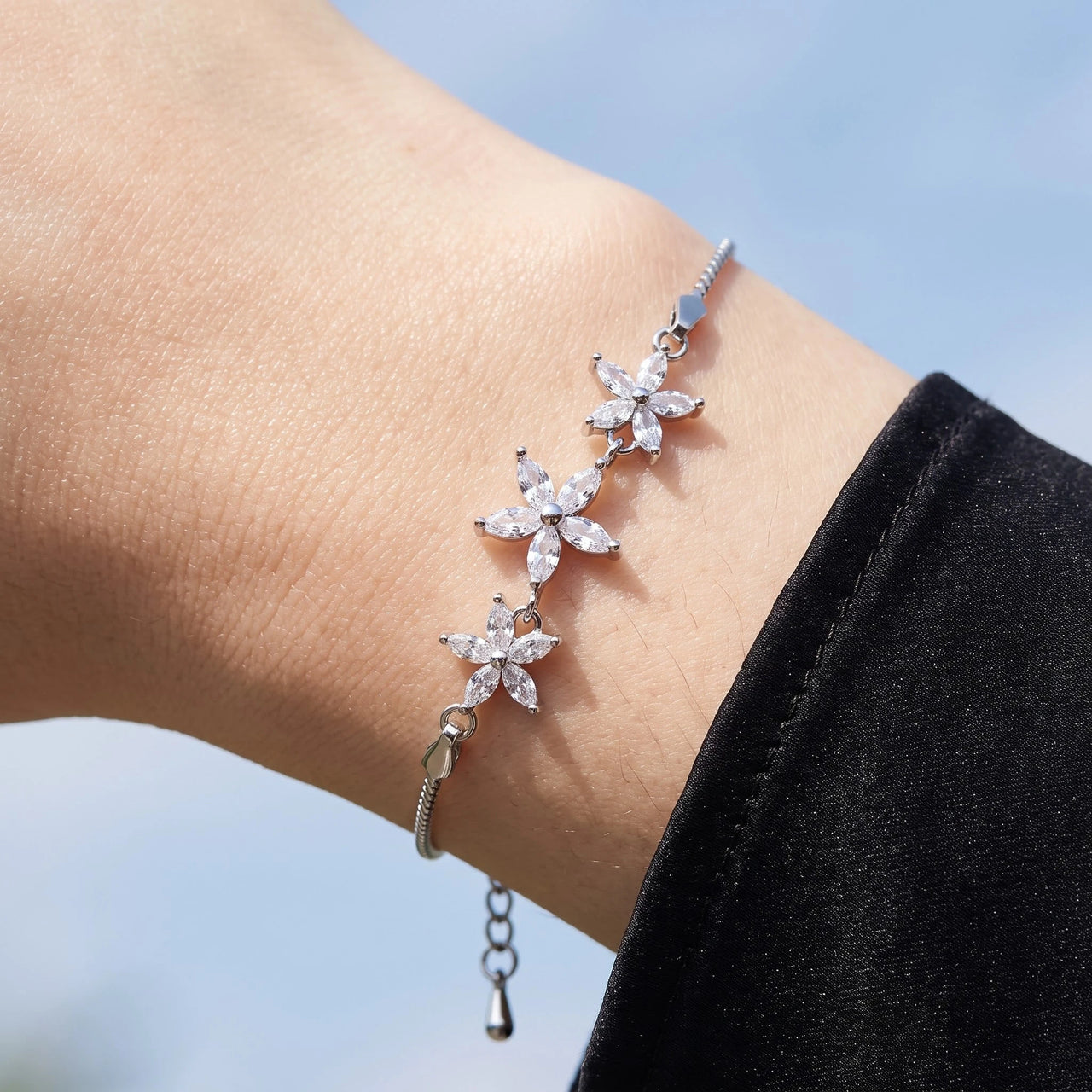 Close-up of the Austrian Crystals Flowers bracelet in silver worn | SKU: 422177-white-gold-XS-S