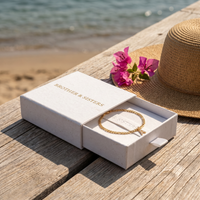 Thumbnail for Pavé Initial Anklet in Brother & Sisters gift box on beach