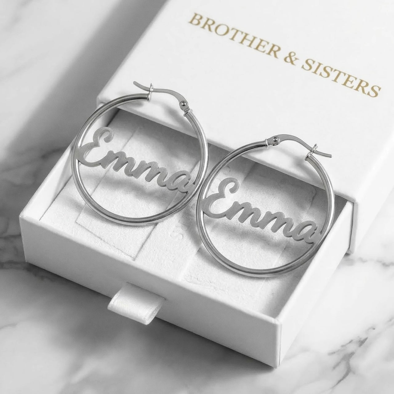 Custom Name Hoop Earrings in Silver in the Brother & Sisters gift box | SKU: name-hoop-silver-30-mm