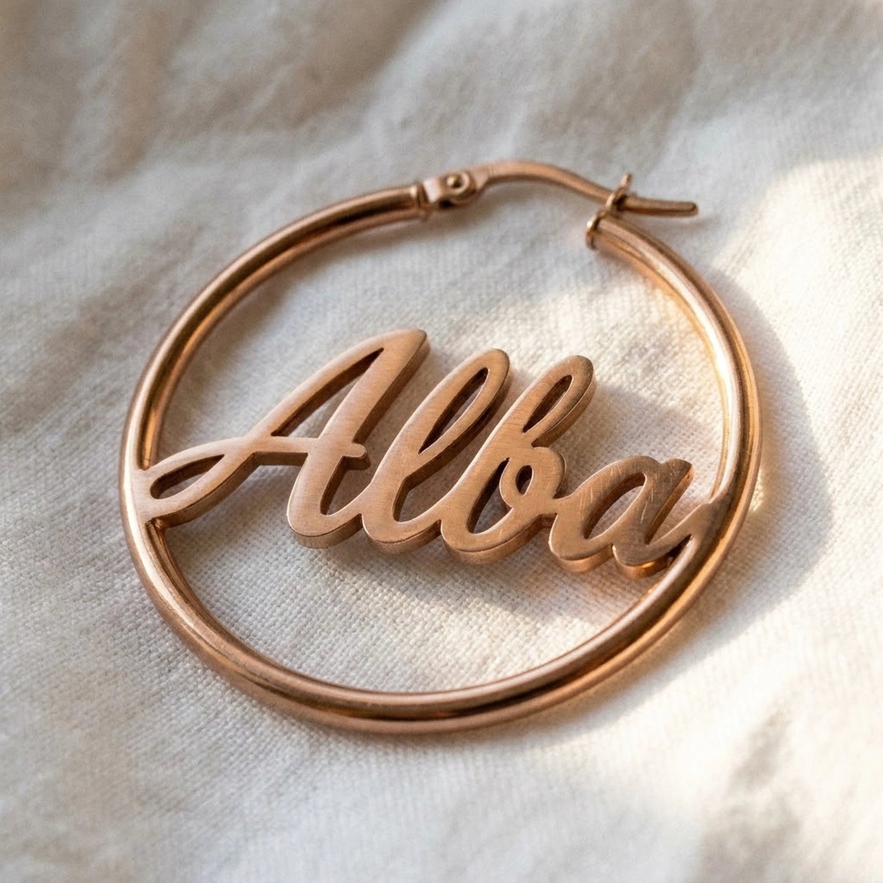 Custom Name Hoop Earrings in Rose Gold, macro detail of the metal and the finish | SKU: name-hoop-rose-gold-30-mm