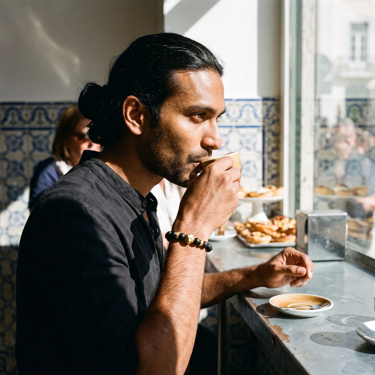 Gold Lion & Black Stones Bracelet – worn while drinking an espresso | Brother & Sisters | SKU: 20712286-gold-XS-14-15, 20712286-gold-S-16-17, 20712286-gold-M-18-19, 20712286-gold-L-20-21, 20712286-gold-XL-22-23