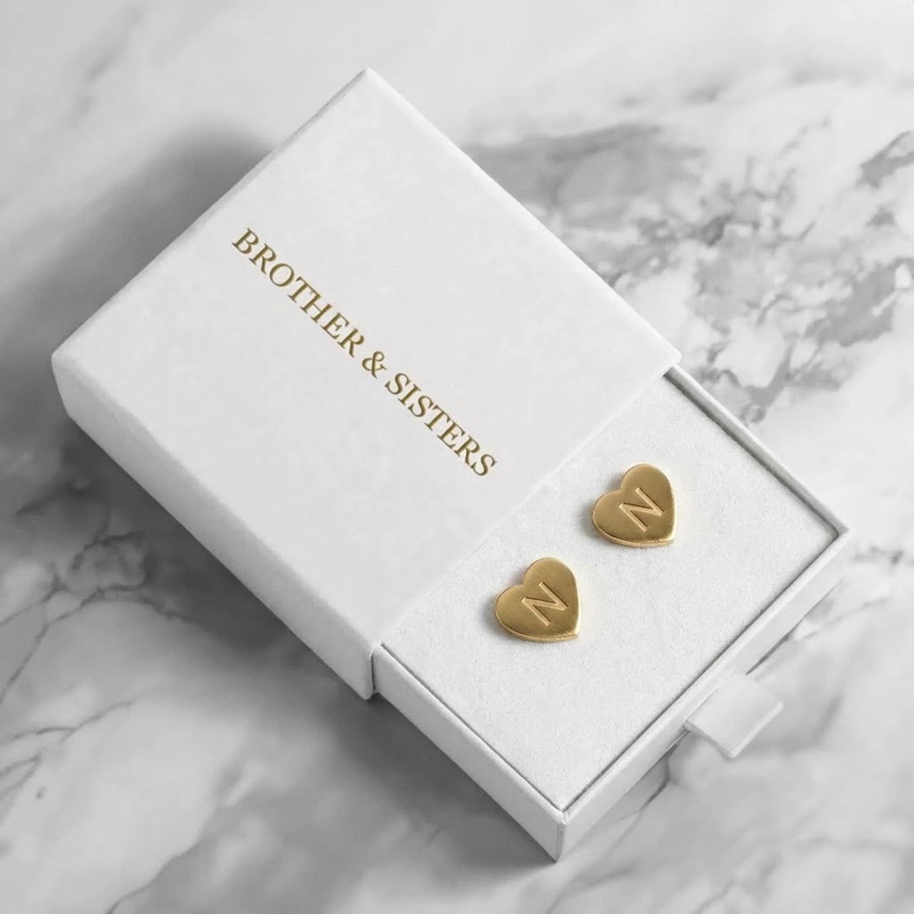 Heart Initial Stud Earrings in Gold in the Brother & Sisters gift box | SKU: heart-initial-gold-a