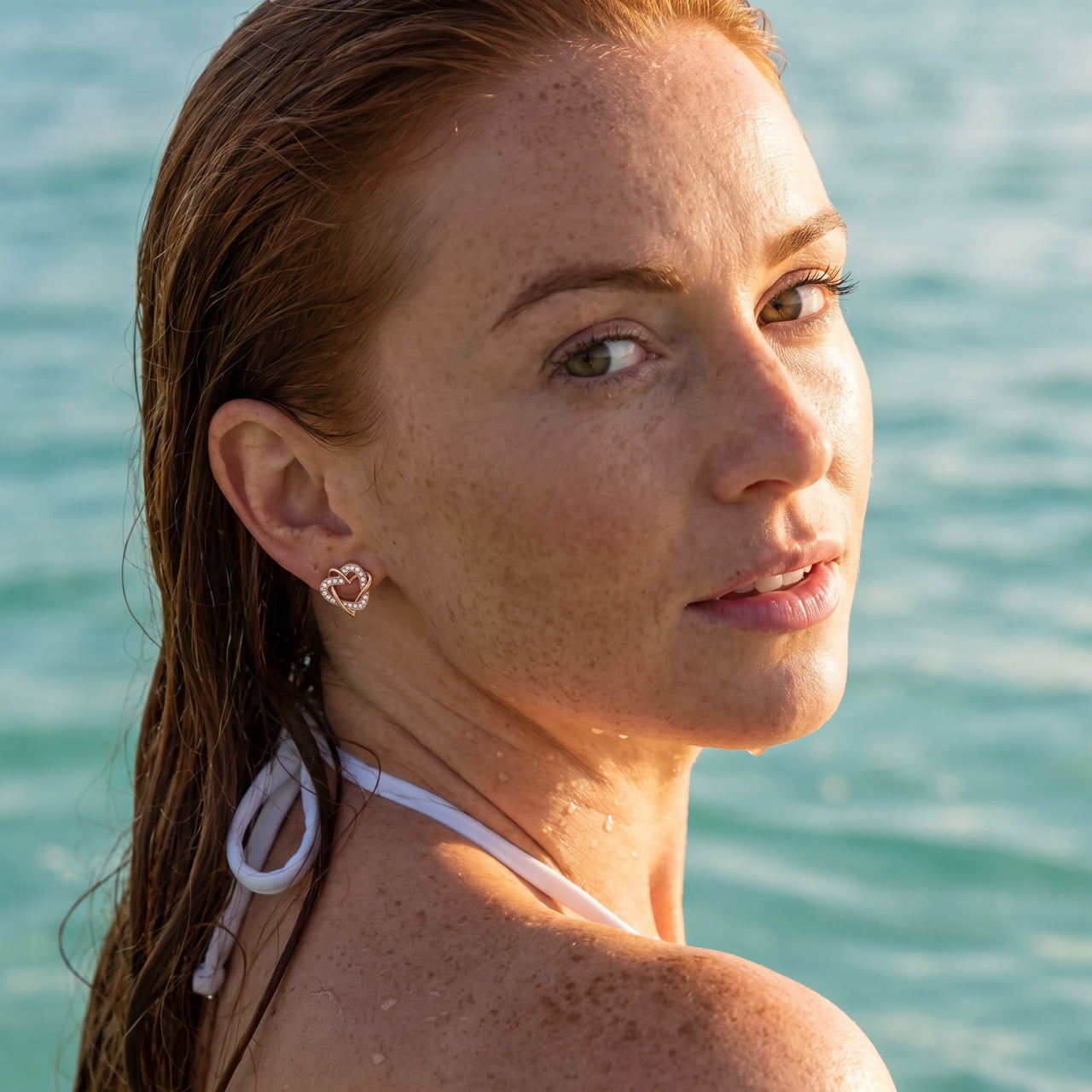 Rose gold stud earrings worn in the sea, waterproof stainless steel with water drops | SKU: 419593-rose-gold
