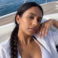 Thumbnail for Woman on a yacht wearing the silver stud earrings | SKU: 4478648-platinum-plated-clear