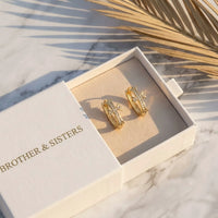 Thumbnail for Pave Cross Huggie Hoops in Gold, in the gift box | SKU: 41006-gold