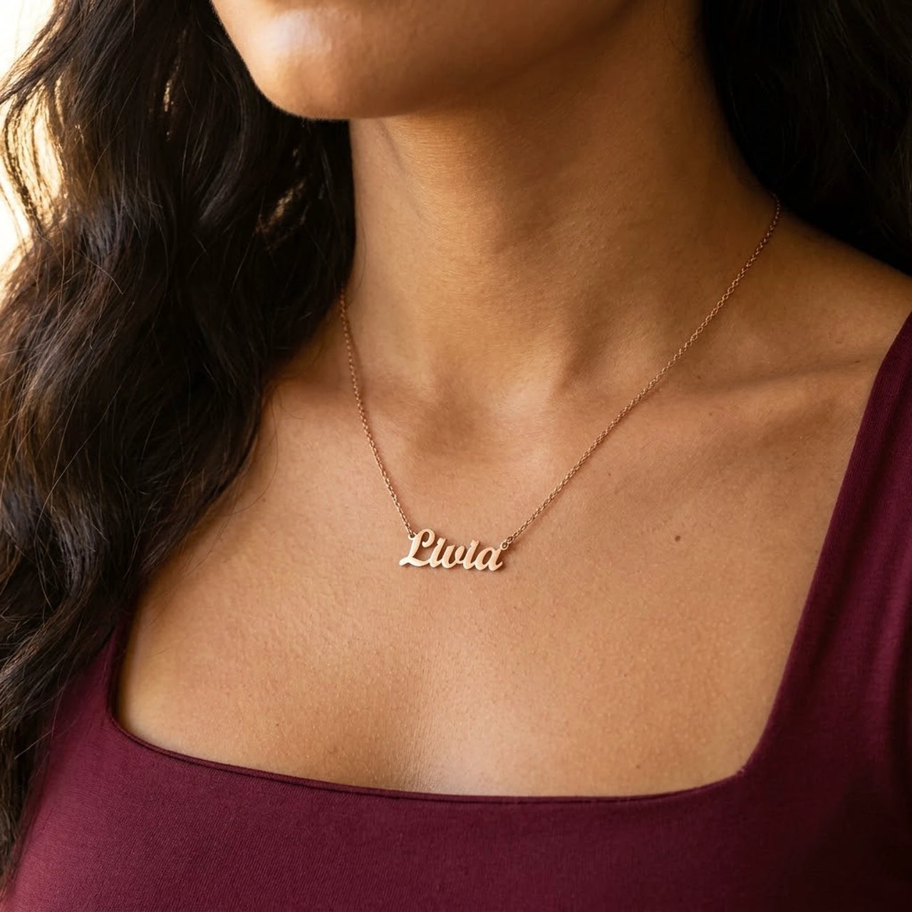 Minimalist Name Necklace in rose gold worn at the collarbone, the name Livia | SKU: minimalistnn-rosegold