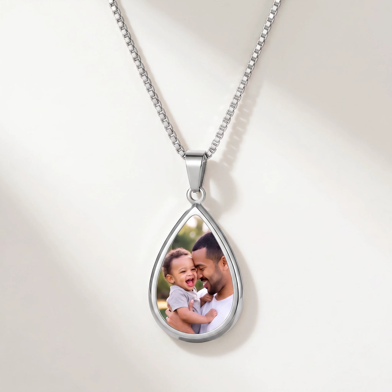 Secret Drop Photo Necklace in silver, teardrop pendant on a box chain showing the hidden photo | SKU: TPH-DRPN-SILVER