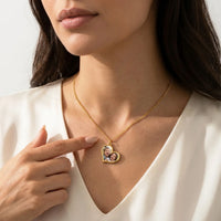 Thumbnail for Woman touching the gold secret heart photo necklace, the hidden photo of her children appears | SKU: TPH-HRTN-GOLD
