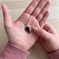 Thumbnail for Thumb warming the rose gold heart pendant: the hidden photo appears under the thumb while the rest stays black | SKU: TPH-HRTN-ROSEGOLD
