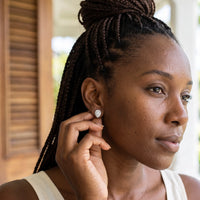 Thumbnail for Woman gently touching her silver stud earrings | SKU: 505174