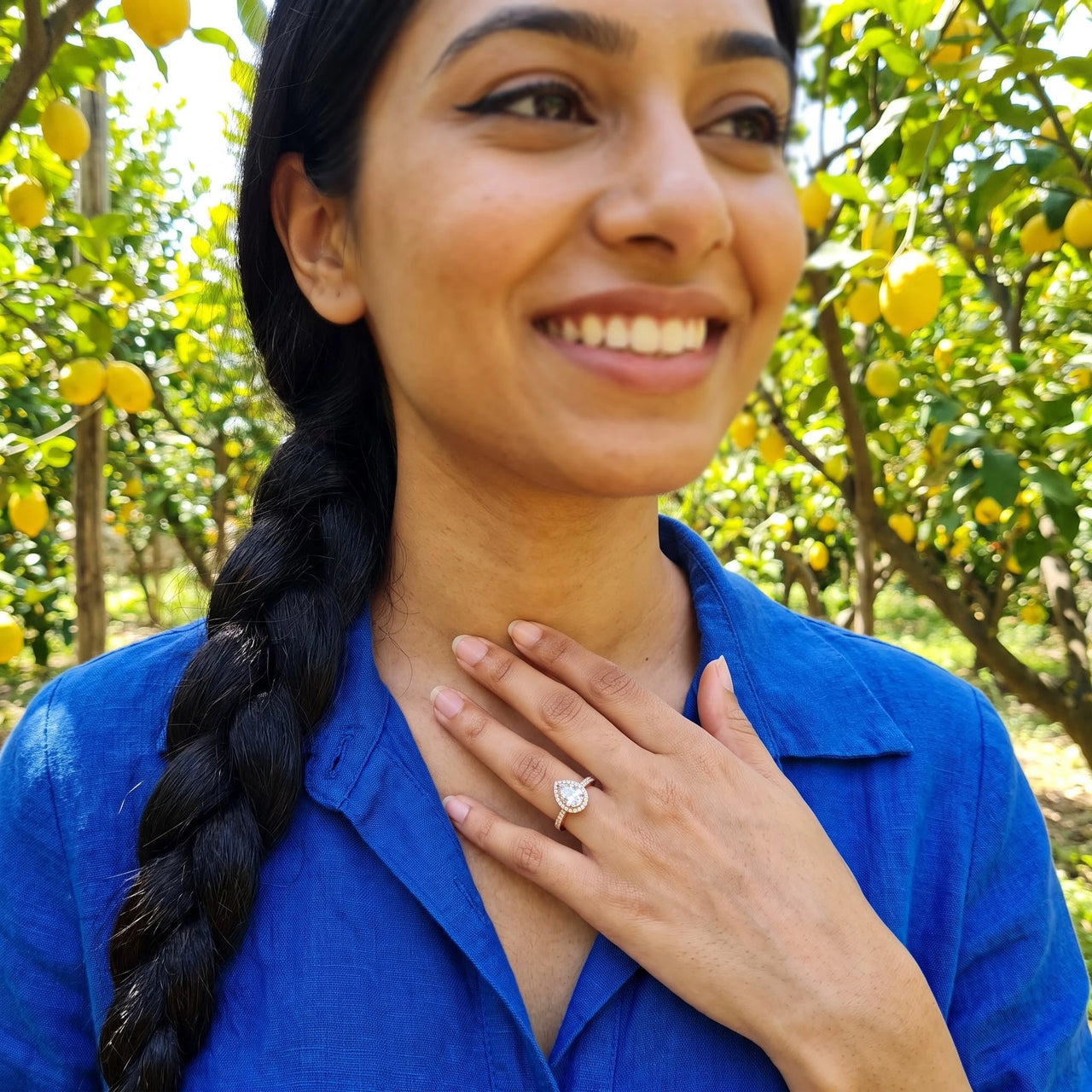Woman gently touching her Rose Gold Drop Ring | SKU: 505162-4.5-rose-gold