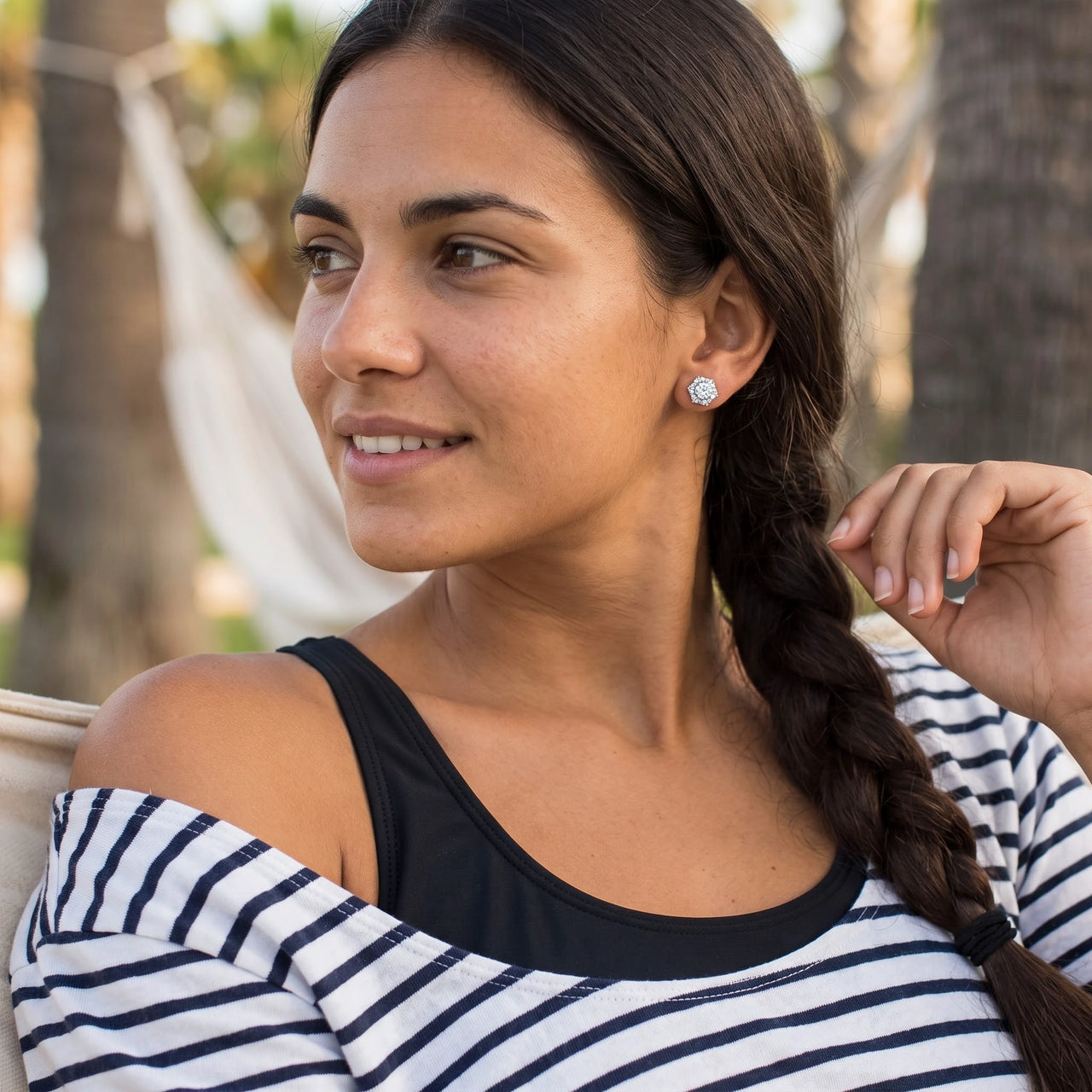 Woman relaxing on holiday wearing the silver stud earrings | SKU: 30876249